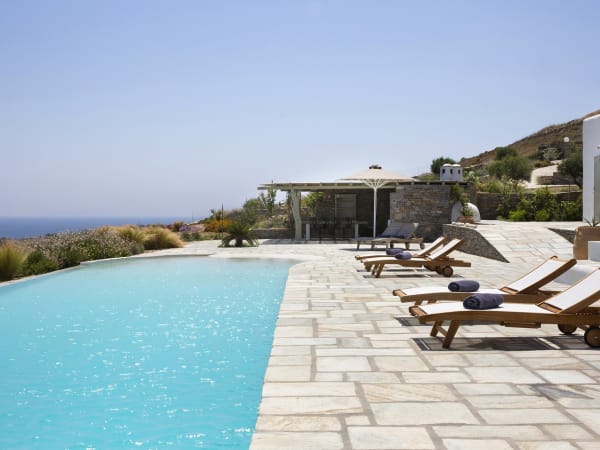 Relaxing poolside with those glorious sea views.